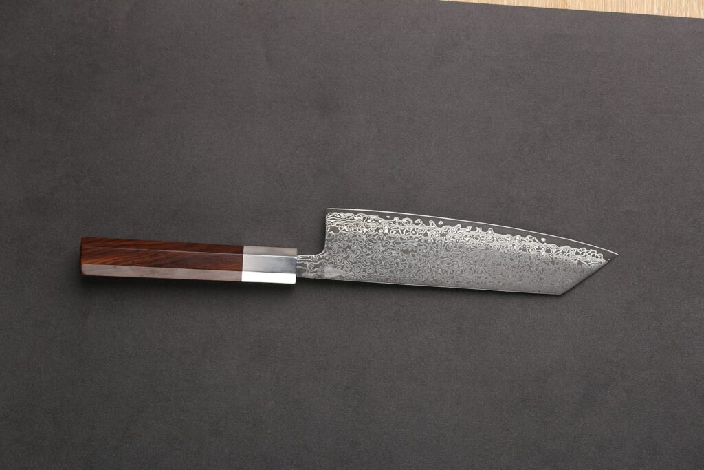 a knife on a cutting board with a wooden handle